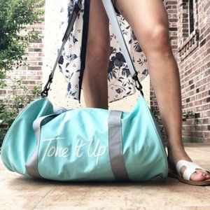 Tone It Up TIU cylinder round end duffle in light blue (teal)